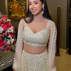 Another angle of this stunning party glam look. The sleek hair and glowing skin are perfect for a cocktail event.