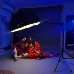 A wide shot showing our studio setup for a traditional maternity shoot. We create a comfortable space for you to relax and enjoy the experience.