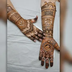 This bridal design combines different elements on each hand. One hand features a bride portrait within a circular frame, while the other showcases traditional patterns and wedding symbols like the kalash.