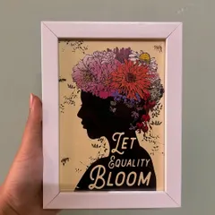 A powerful message in a frame: "Let Equality Bloom." This custom piece features a beautiful silhouette and floral design, perfect for adding an inspiring touch to any space.