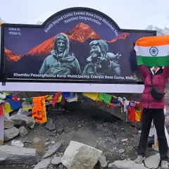 A proud moment at Everest Base Camp, holding the flag high. This trek is a serious test of endurance, and getting here required a specific training plan focused on acclimatization and stamina. I design programs that get you ready for the altitude and the daily grind of the trail.
