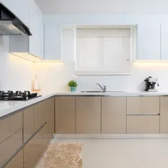This angle highlights the ample counter space and the natural light coming from the window. A well-lit kitchen is a joy to cook in, and this space is designed to be bright and airy.