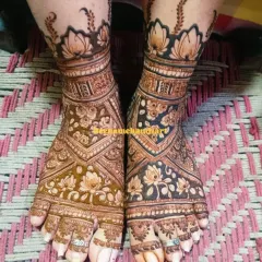Your bridal look isn't complete without beautiful mehandi on your feet. This is a great example of a full coverage design with delicate lotus motifs and intricate patterns that look stunning.