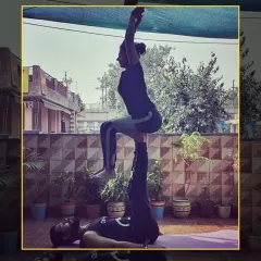 Balance, trust, and strength are the pillars of acrobatic yoga. This pose, known as "throne," requires a stable base and a confident flyer.