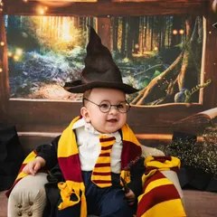 The sorting hat has spoken. This baby is ready to begin his magical education in this enchanting Harry Potter setup.