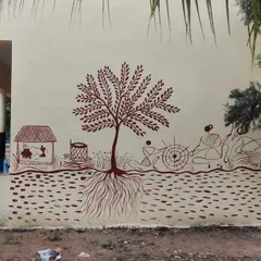 On another wall at the same school, I painted this large mural using a different technique. The red-brown line art on the light wall shows a village scene with a prominent tree, demonstrating how the style can be adapted.