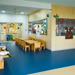 Our classroom is transformed with handmade decorations for the Christmas celebration. The space feels warm and inviting, ready for a fun evening of performances and games.