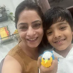 Look at this adorable little bird! A proud student shows off his creation from our craft workshop. These activities are great for developing fine motor skills.