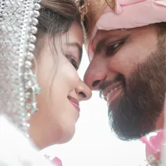 An intimate close-up of a Hindu bride and groom. This shot focuses on the emotional connection and happiness shared between the couple right after their ceremony.