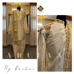 Another look at a custom silk 'Muhurtam' outfit. This one features detailed gold embroidery on the shoulders and collar, paired with a traditional silk dhoti and shawl.