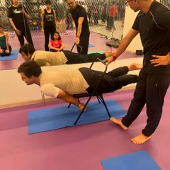 Using a chair to build core and arm strength in Mayurasana (Peacock Pose). This prop makes advanced arm balances more accessible for students building their strength.