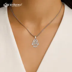 The Hamsa Hand is a powerful symbol of protection. This sterling silver pendant features five zirconia stones, offering a blend of spiritual significance and modern sparkle.