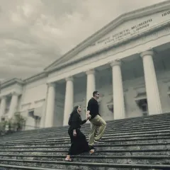 A classic pre-wedding pose on the steps of The Asiatic Society of Mumbai Library. The colonial architecture provides a grand and timeless setting for elegant couple portraits.