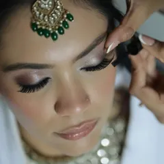 A macro shot showing the precision of lash application. I ensure every lash is perfectly placed to enhance the eyes while looking seamless and natural. This is a key step for a polished look.