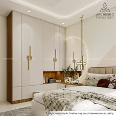 A modern bedroom wardrobe with integrated dressing table. The white doors with geometric handles and wood accents create a clean, contemporary look.