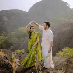A joyful dance on a rocky outcrop, with the beautiful hills of Karnataka in the background. Capturing movement and happiness is key to my style.
