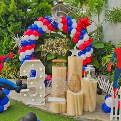I bring popular kids' themes to life, like this action-packed Spider-Man party. The setup includes a custom balloon arch, large character cutouts, and a light-up marquee number, creating an exciting world for the birthday boy.