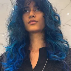 Another angle of this stunning blue hair, a perfect choice for a bold statement.
