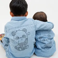 Sometimes the best shots are the ones you don't plan. This photo of the brothers' matching panda shirts shows a cute detail that adds personality to their sibling portrait session.