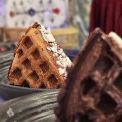 A slice of our classic waffle, perfectly golden and ready for toppings. A simple yet satisfying dessert.