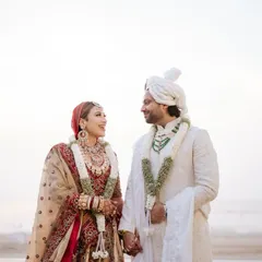 A classic portrait against a serene beach backdrop. We plan destination weddings that offer stunning natural scenery for your couple photoshoots.