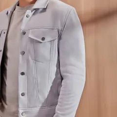 This is for when a blazer feels like too much. The suede shacket in a soft grey is a perfect layering piece, offering a relaxed fit that is still luxe and contemporary.