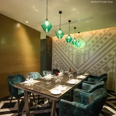 I provide exclusive settings for your most private moments. The Private Dining Room at Zodiac, with its plush velvet seating and striking marble table, offers an intimate and luxurious atmosphere for special family dinners or high-level business meetings.