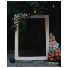 A versatile rustic photo frame, perfect for any outdoor or chic-themed event. Here it's styled with a modern balloon garland in earthy tones.