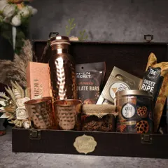 This leather-finish trunk hamper includes premium snacks and hammered copperware. Sourcing unique, high-quality products is a key topic in my business coaching sessions.
