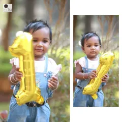A sweet outdoor portrait of a one-year-old holding a '1' balloon, perfect for a pre-birthday photoshoot.