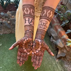 Your mehendi can tell your story. For this bride, we included her and her partner's initials 'HA' and a special teddy bear motif that was meaningful to them. I can incorporate any element that is special to you.
