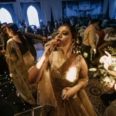 A guest enjoying a drink and the music on a packed dance floor. Our goal is to make sure everyone can let loose and have a great time.