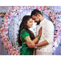 An intimate and romantic portrait of the newly engaged couple, surrounded by beautiful floral decor.