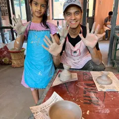 Messy hands and big smiles. This father-daughter duo is proudly showing off their work after a fun and creative Father's Day hand-building session at our studio.