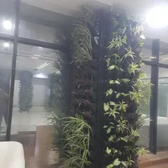 This freestanding vertical garden acts as a natural divider in an office space. It’s a smart way to define areas while adding greenery and improving acoustics.