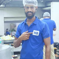 One of our proud team members pointing to the HB logo on his uniform. We take pride in our work and our brand.