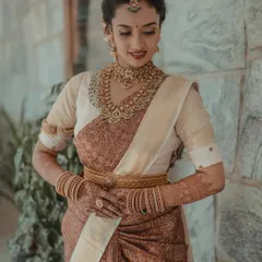 A portrait of timeless South Indian bridal beauty. I focus on capturing the intricate details of the silk saree, the temple jewelry, and the bride's serene expression.