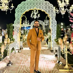 Hosting the wedding of a beautiful couple in Pushkar. A sharp suit and a grand decor make for a perfect reception evening.