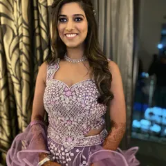 A beautiful, smiling Sangeet bride. She looks absolutely ready to dance the night away, and her glam makeup is the perfect accessory.