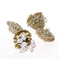 A closer look at our kundan and pearl jhumkas. The combination of sparkling stones and lustrous pearls creates a look of pure elegance, perfect for a bride or bridesmaid.