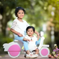 Sibling adventures are the best! Using fun props like this little scooter, I capture the playful energy and sweet friendship between sisters during a fun-filled outdoor photoshoot. These are the memories of childhood they'll look back on and smile.
