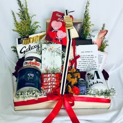 A grand and indulgent hamper perfect for a birthday or anniversary. This "Indulge in Goodness" basket is overflowing with Galaxy and KitKat chocolates, Nutella, gourmet popcorn, and a personalized mug.