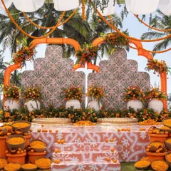 A stunning marigold-themed haldi stage with intricate patterns and a fresh, modern feel. The use of traditional flowers in a contemporary design is perfect for a destination wedding in Goa.