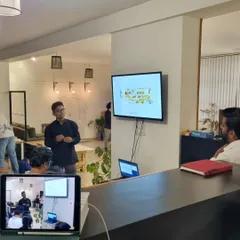 A presenter shares insights during our Reading Series. These sessions are a platform for our team and collaborators to share knowledge and provoke thoughtful conversations about design and the world around us.