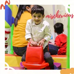 The mischievous smile. You know this little guy is having a blast and planning his next adventure on the rocking horse.