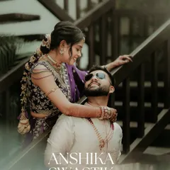 A stylish and modern couple portrait. The bride drapes her arm around the groom, both looking cool and confident, with clean text overlay adding a magazine-like quality.