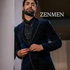 A model showcasing the fit and feel of the blue velvet tuxedo. This piece is designed to look sharp from every angle, making it ideal for photoshoots and grand entrances.