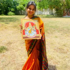 Holding my finished Mysore-style painting. Embracing and learning this heritage art form is something I take great pride in as an artist from Mysore.