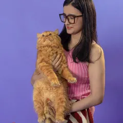 For commercial shoots, we create a fun and comfortable atmosphere for both pets and their humans. Here, we captured a moment of genuine connection between a model and a fluffy Persian cat for a vibrant brand campaign.