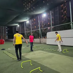 Setting up for success. Before the party kicks off, our team meticulously arranges the agility ladders, hurdles, and cones to create a challenging and fun obstacle course on the turf.